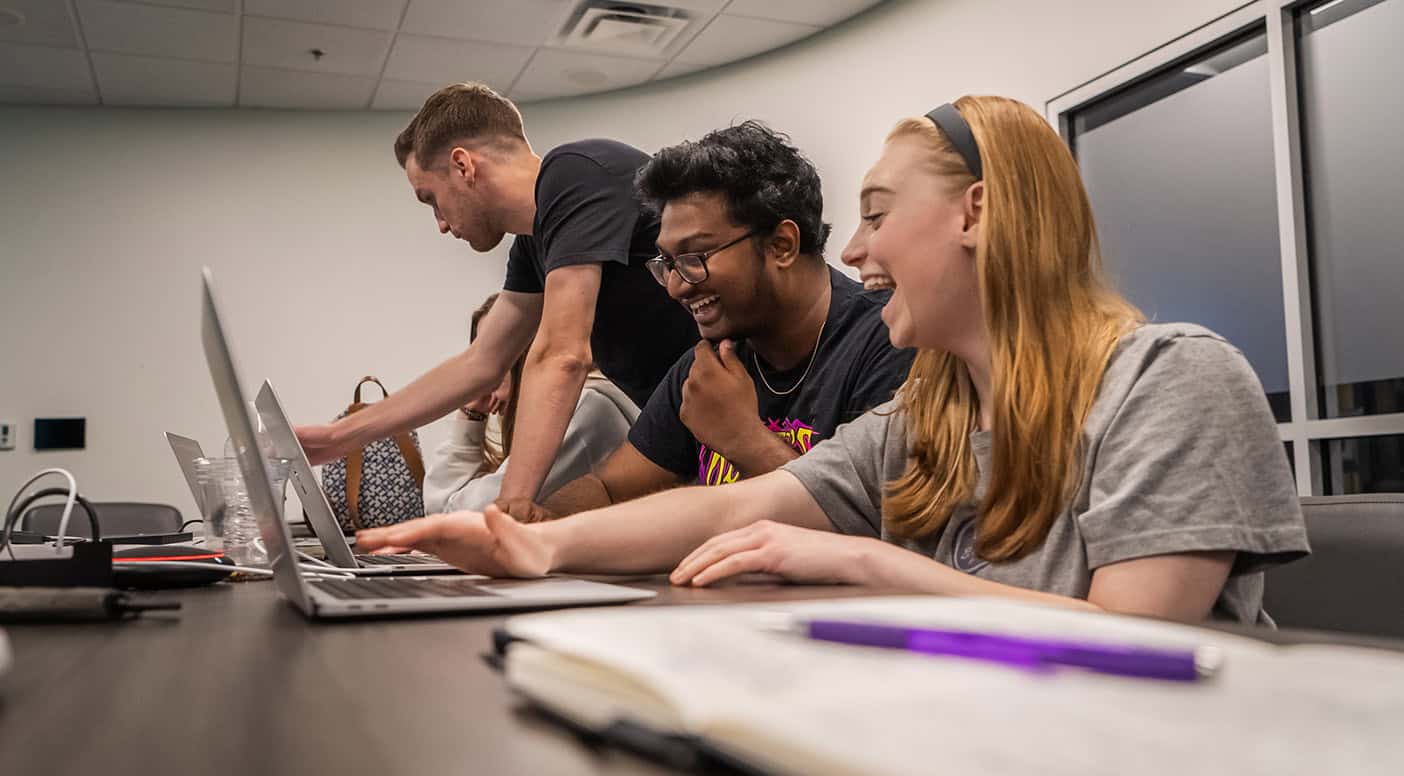 A group of happy Rolling Hills interns working together