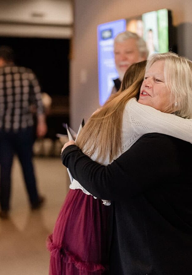 two-people-hugging-in-the-lobby